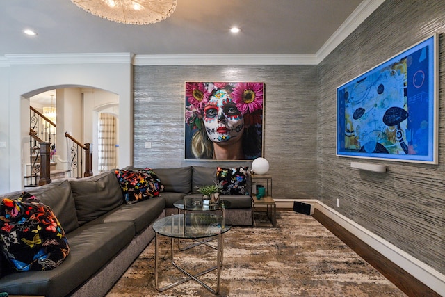 living room featuring arched walkways, crown molding, stairway, and recessed lighting