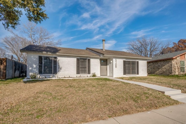 single story home with fence, a front lawn, and brick siding