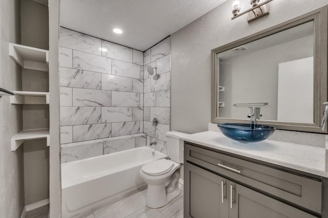 bathroom featuring toilet, visible vents, shower / washtub combination, and vanity