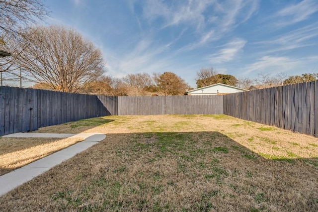 view of yard with a fenced backyard