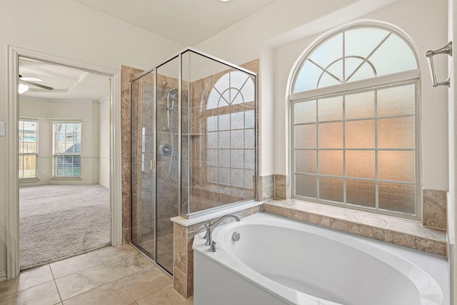 full bathroom with tile patterned flooring, a shower stall, a ceiling fan, and a bath