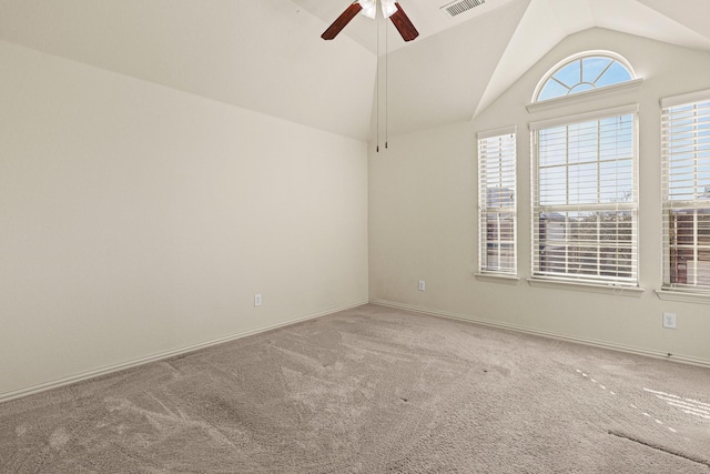 empty room featuring visible vents, baseboards, a ceiling fan, lofted ceiling, and carpet