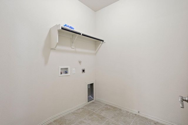 washroom featuring laundry area, baseboards, hookup for a gas dryer, hookup for a washing machine, and electric dryer hookup