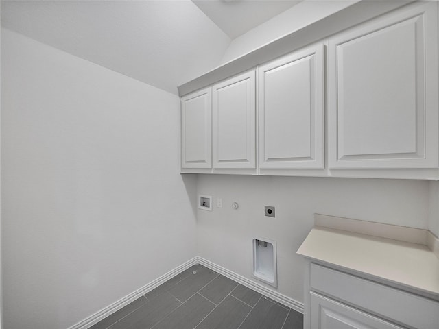 laundry area with cabinet space, baseboards, hookup for a gas dryer, hookup for a washing machine, and hookup for an electric dryer