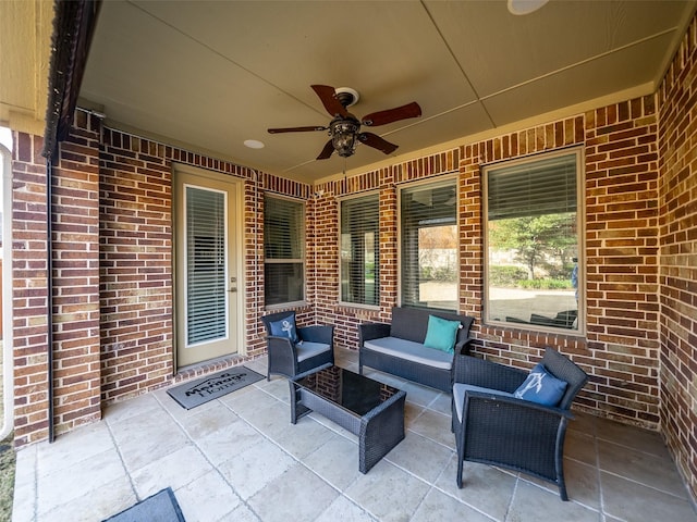 view of patio / terrace featuring ceiling fan and an outdoor living space