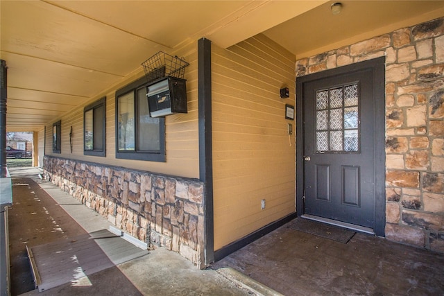 view of exterior entry with stone siding