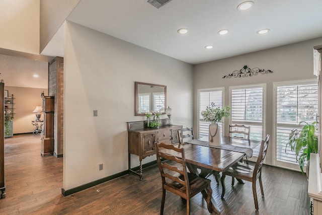 dining area featuring recessed lighting, dark wood finished floors, and baseboards