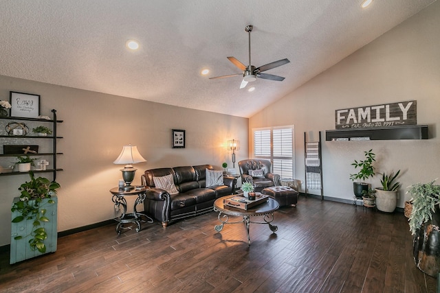 living room featuring dark wood-type flooring, a textured ceiling, baseboards, and a ceiling fan