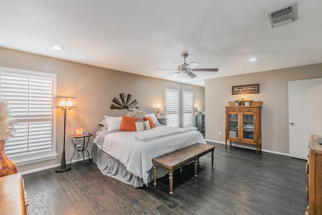 bedroom with baseboards, visible vents, a ceiling fan, dark wood-style flooring, and recessed lighting