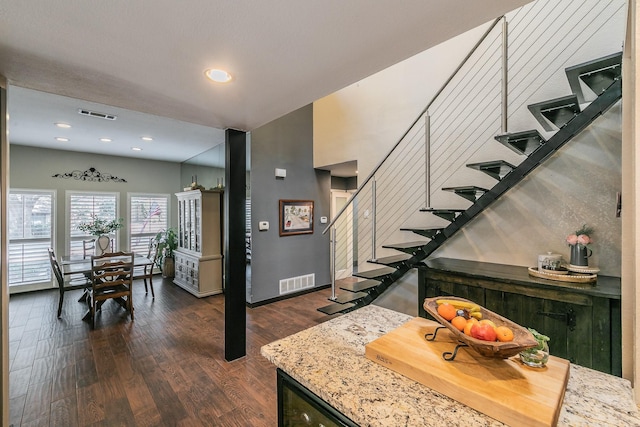 interior space with recessed lighting, visible vents, baseboards, and wood finished floors