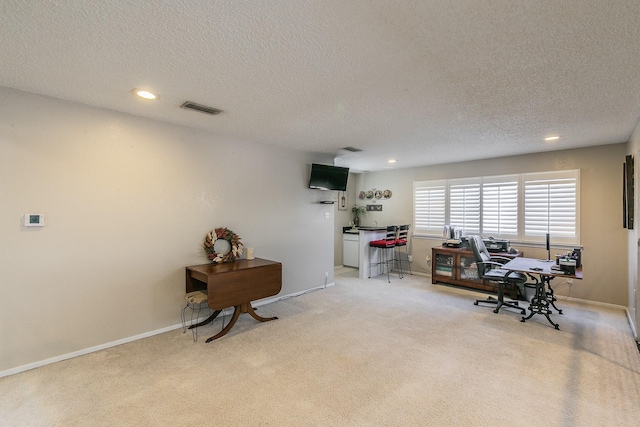 office area featuring recessed lighting, light colored carpet, visible vents, and baseboards