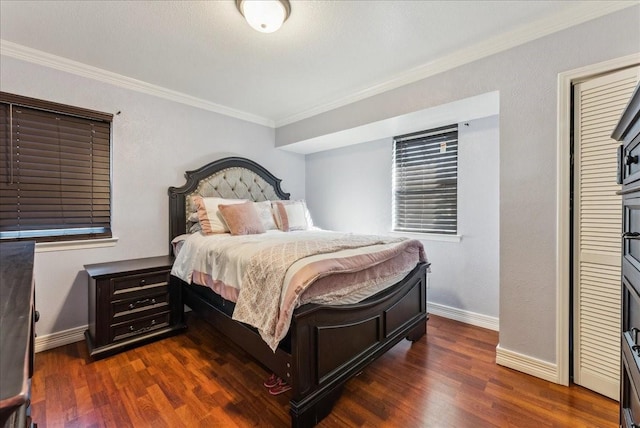 bedroom with ornamental molding, dark wood-type flooring, and baseboards