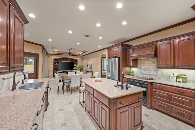 kitchen with arched walkways, custom range hood, a sink, and black appliances