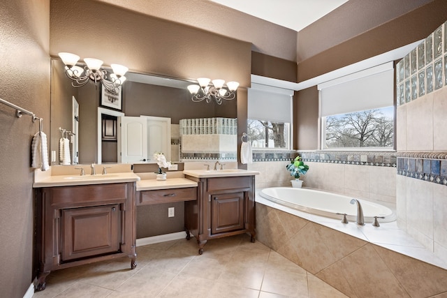 full bath with a chandelier, a garden tub, and a sink