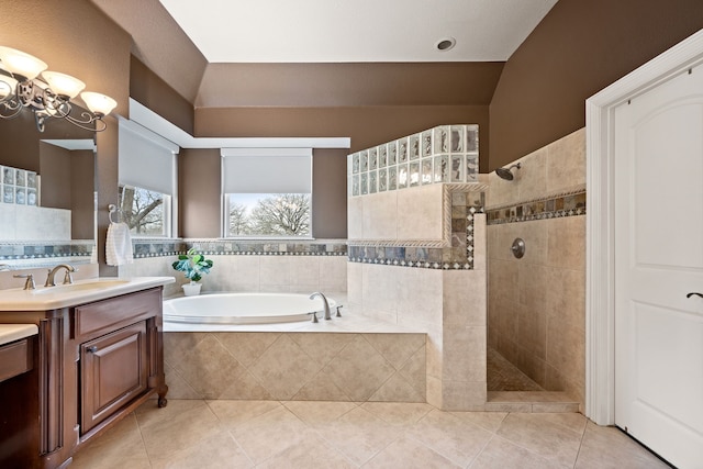 full bathroom featuring a chandelier, a walk in shower, a bath, and vanity