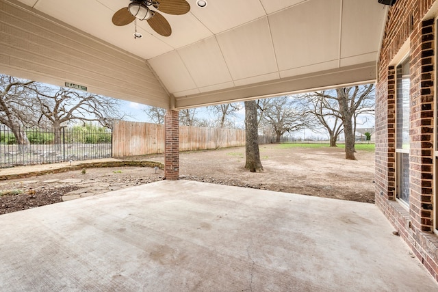 view of patio / terrace with fence and a ceiling fan