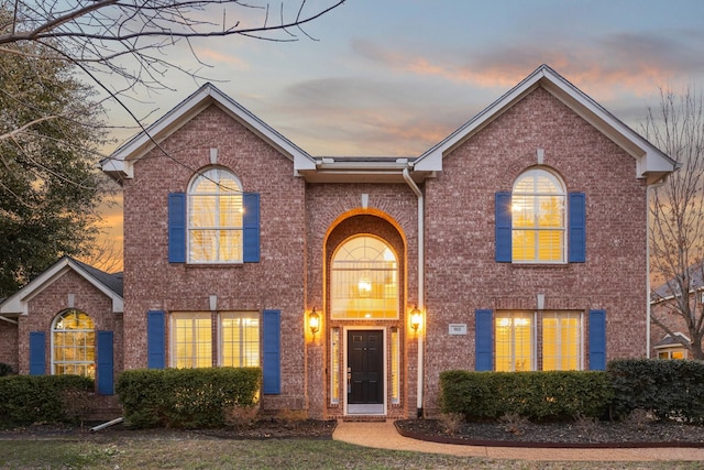 traditional-style house with brick siding