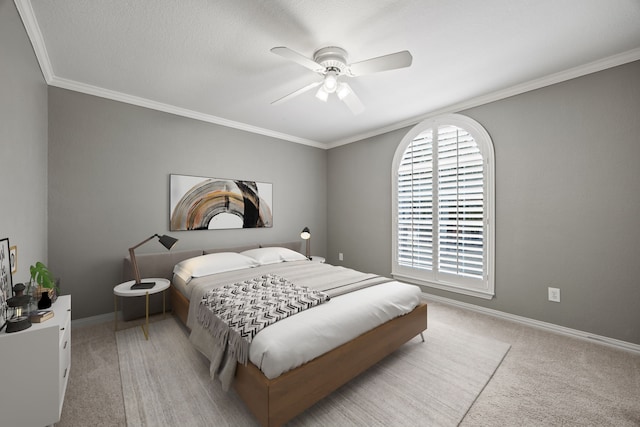 bedroom with a ceiling fan, light colored carpet, crown molding, and baseboards