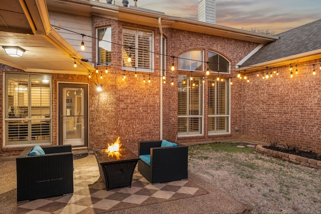 view of patio / terrace with a fire pit