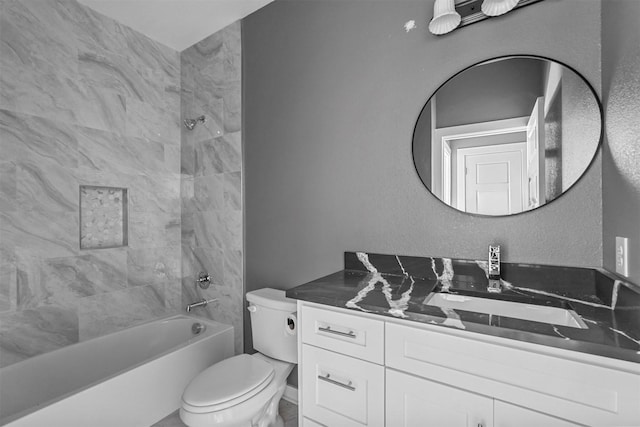 bathroom featuring shower / washtub combination, vanity, and toilet