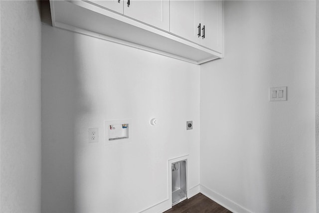 clothes washing area with dark wood-style floors, washer hookup, cabinet space, electric dryer hookup, and baseboards