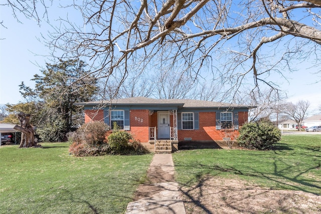 ranch-style house with crawl space, brick siding, and a front lawn