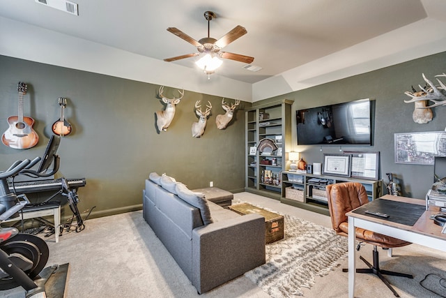 living area featuring light carpet, ceiling fan, visible vents, and baseboards