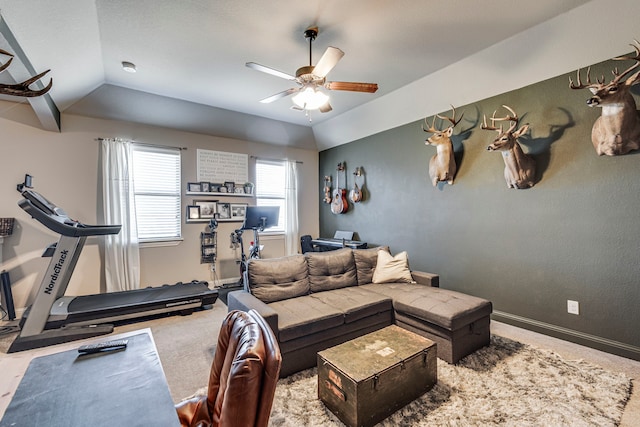 living room featuring a ceiling fan, lofted ceiling, carpet floors, and baseboards