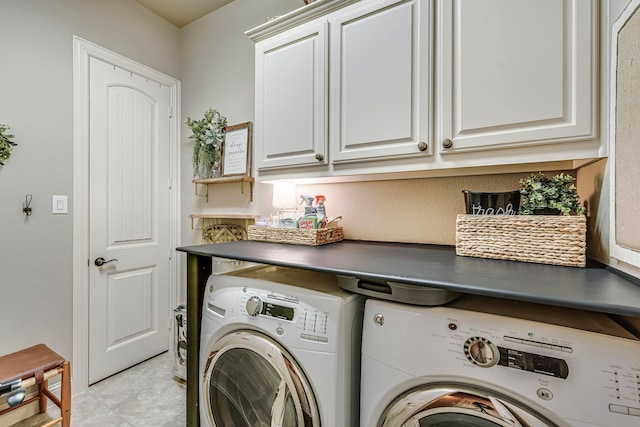 washroom with cabinet space and independent washer and dryer