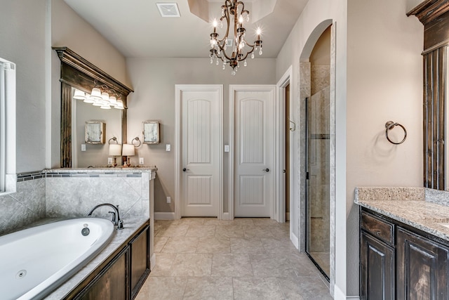 full bathroom featuring a chandelier, vanity, visible vents, a shower stall, and a bath