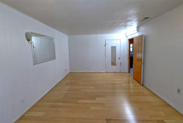 spare room with visible vents and light wood finished floors