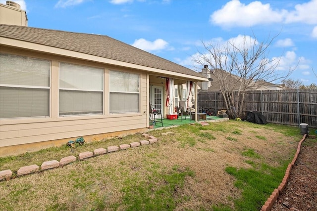 view of yard featuring a patio area and a fenced backyard