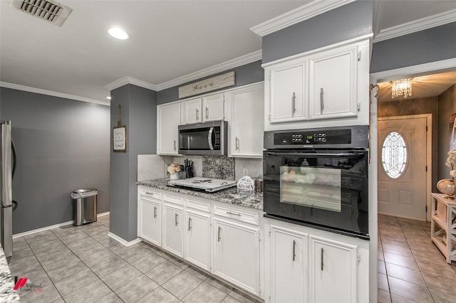 kitchen with stone counters, visible vents, decorative backsplash, appliances with stainless steel finishes, and white cabinets