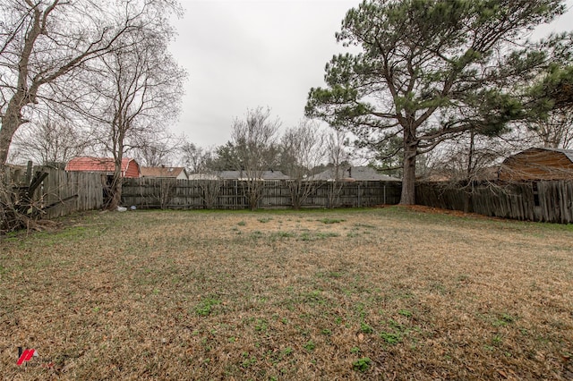 view of yard with a fenced backyard