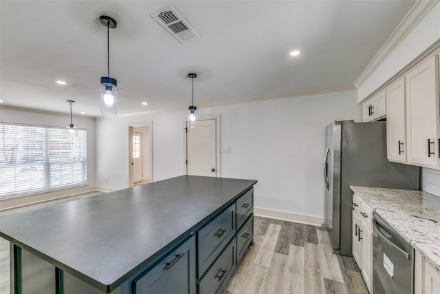 kitchen featuring crown molding, visible vents, stainless steel dishwasher, light wood-style floors, and white cabinets