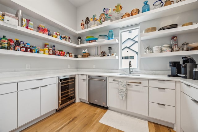 storage area with beverage cooler and a sink