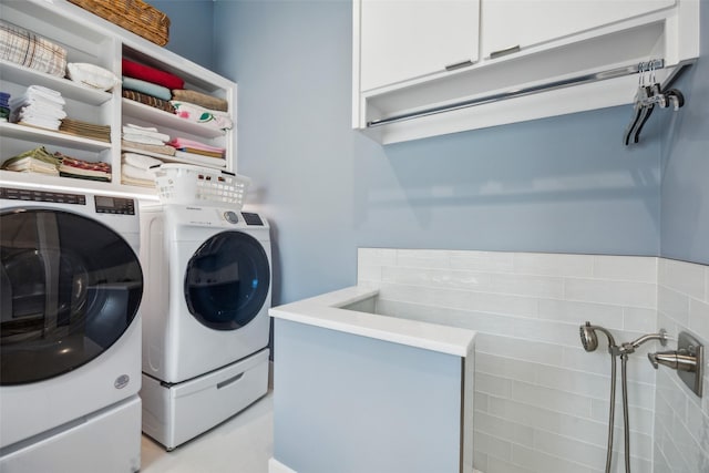 laundry area with laundry area and separate washer and dryer