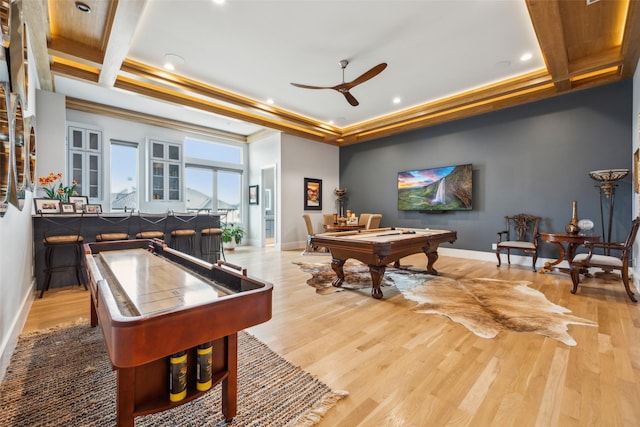 game room with a tray ceiling, baseboards, pool table, and light wood finished floors