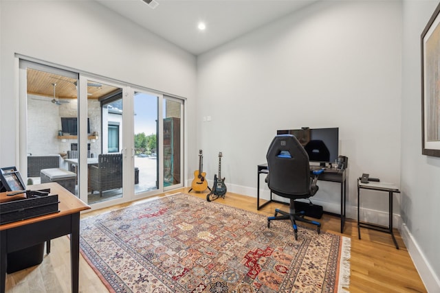 office area with light wood-style floors, recessed lighting, and baseboards