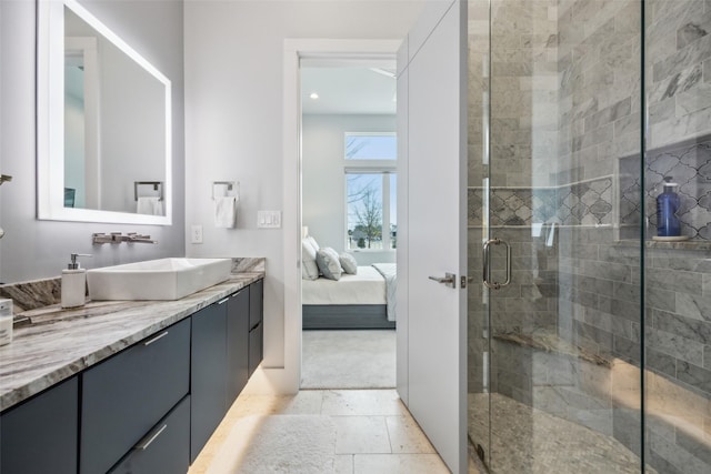 full bathroom with a stall shower, ensuite bath, stone tile floors, and vanity