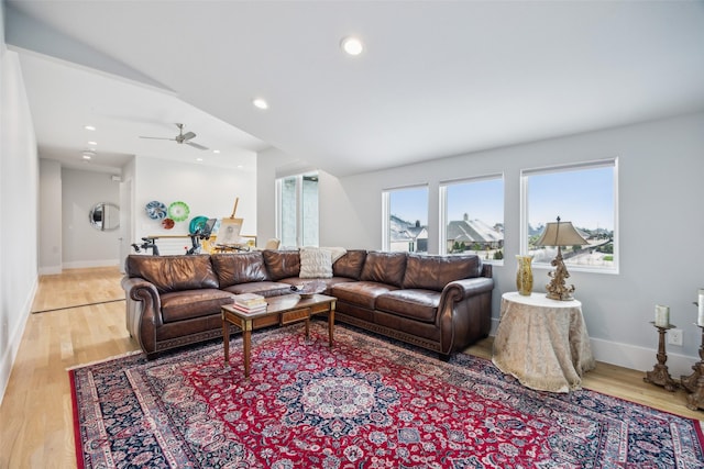 living room featuring light wood-style floors, recessed lighting, ceiling fan, and baseboards