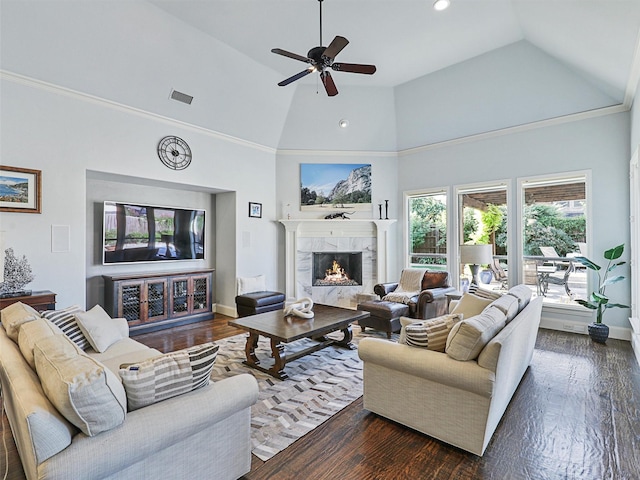 living room with dark wood-style floors, a fireplace, and visible vents