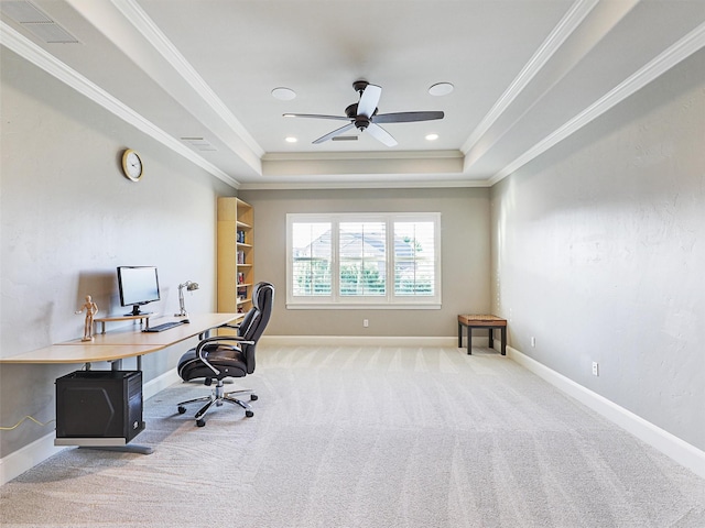 office featuring a tray ceiling, crown molding, recessed lighting, light colored carpet, and baseboards