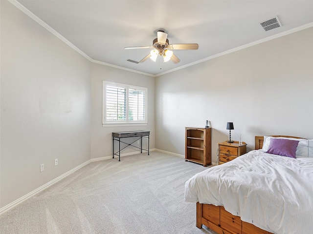 bedroom with baseboards, visible vents, light colored carpet, ceiling fan, and ornamental molding