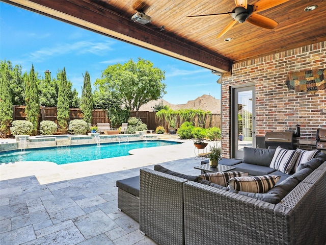 view of pool with a patio, an outdoor living space, a fenced backyard, and a ceiling fan