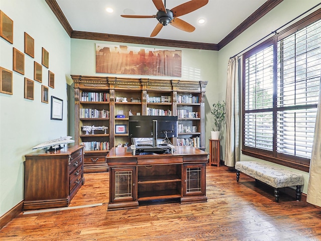 office featuring light wood-style floors, ceiling fan, ornamental molding, and baseboards