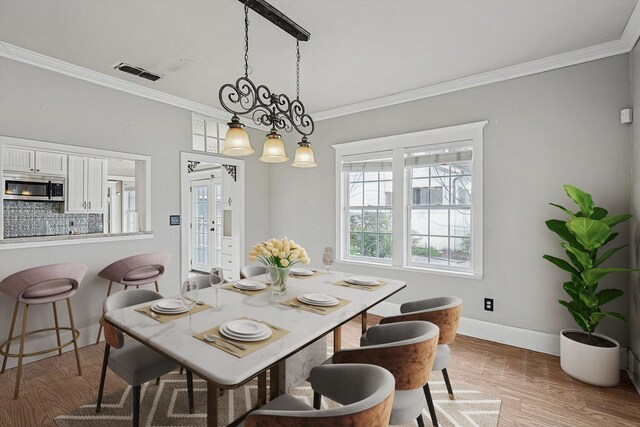 111 S Pine St, Roanoke, TX 76262 - dining area featuring wood finished floors, baseboards, and plenty of natural light