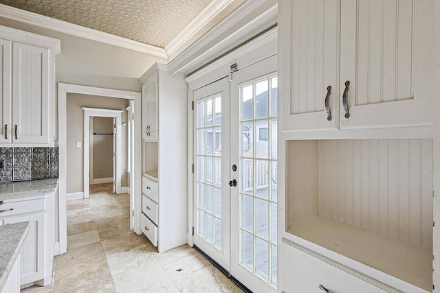 111 S Pine St, Roanoke, TX 76262 - kitchen featuring tasteful backsplash, baseboards, ornamental molding, white cabinetry, and stainless steel appliances