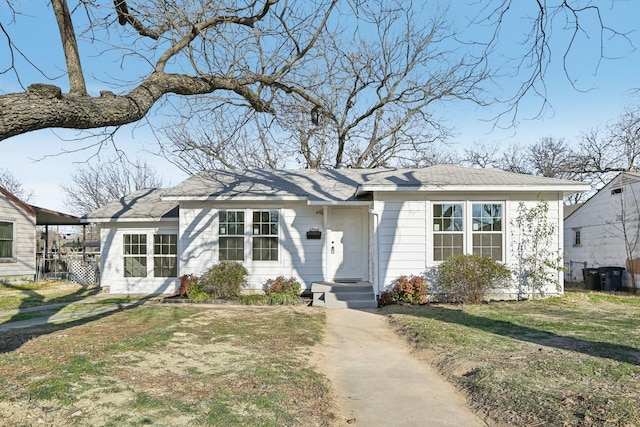 view of front of home with a front lawn