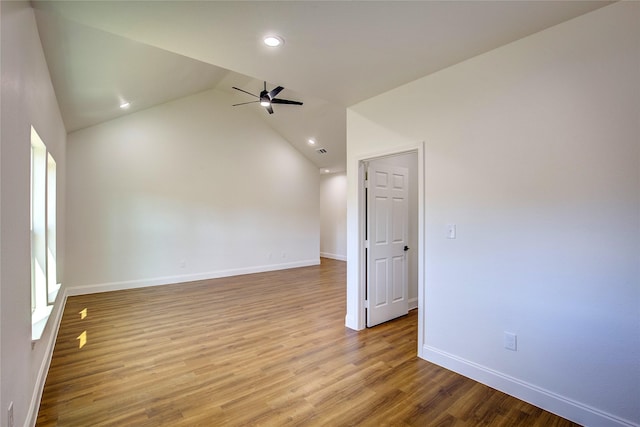 empty room featuring light wood finished floors, baseboards, a ceiling fan, lofted ceiling, and recessed lighting